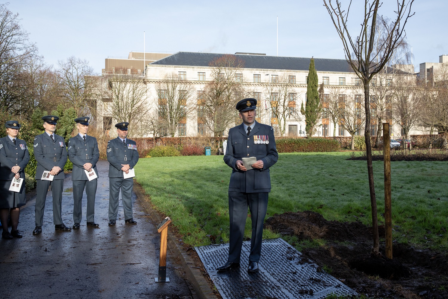 Photo: Wing Commander Olly Walker, Officer Commanding with personnel of No.614 Sqn (County of Glamorgan) Squadron in Alexandra Gardens for the planting of their memorial tree.